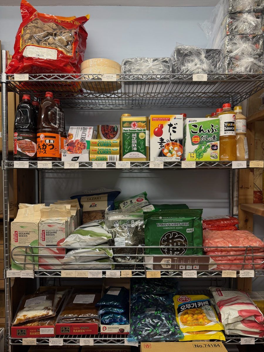 Shelves of soy sauce, sesame oil and other condiment bottles