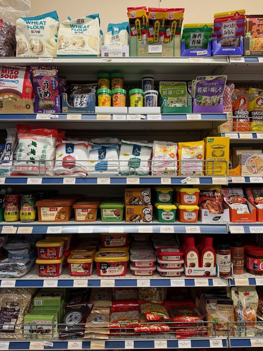 Pantry shelf with flour, furikake, gochujang and seasoning pastes